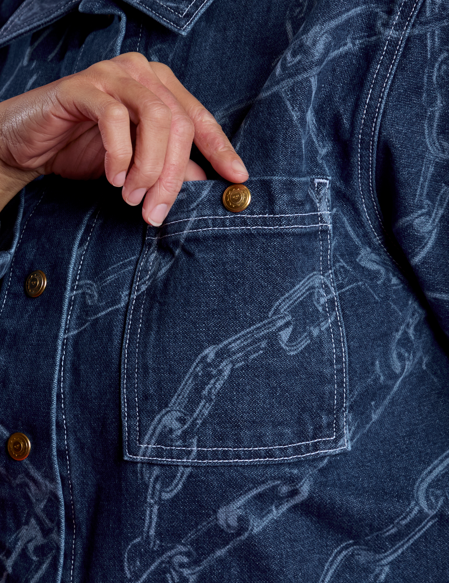 Tiara's hand in front top pocket of the Chain Link Work Jacket
