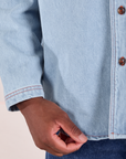 Denim Overshirt in Light Wash bottom close up on Issac