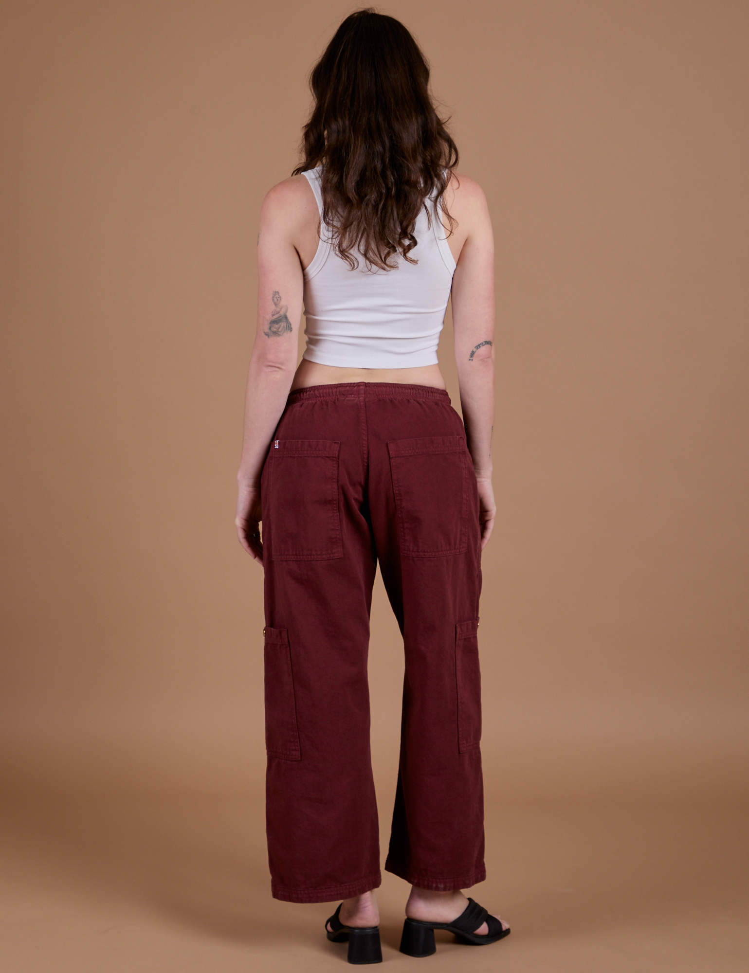 Drop Pocket Cargo Pants in Red Wine back view on Alex