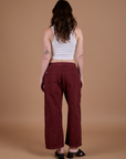 Drop Pocket Cargo Pants in Red Wine back view on Alex