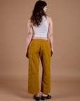 Drop Pocket Cargo Pants in Spicy Mustard back view on Alex