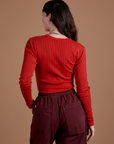 Gingham Long Sleeve Baby Tee in Mustang Red back view on Alex