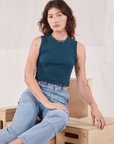 Alex is wearing Muscle Tee in Lagoon and light wash Carpenter Jeans
