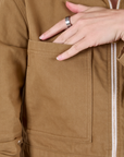 Mechanic Jacket in Desert Brown front pocket close up.