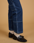 Pant leg side view close up of Mid-Rise Carpenter Jeans in Dark Wash on Alex