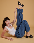 Alex is wearing Baggy Mid-Rise Trousers in French Blue and vintage tee white Cropped Tank