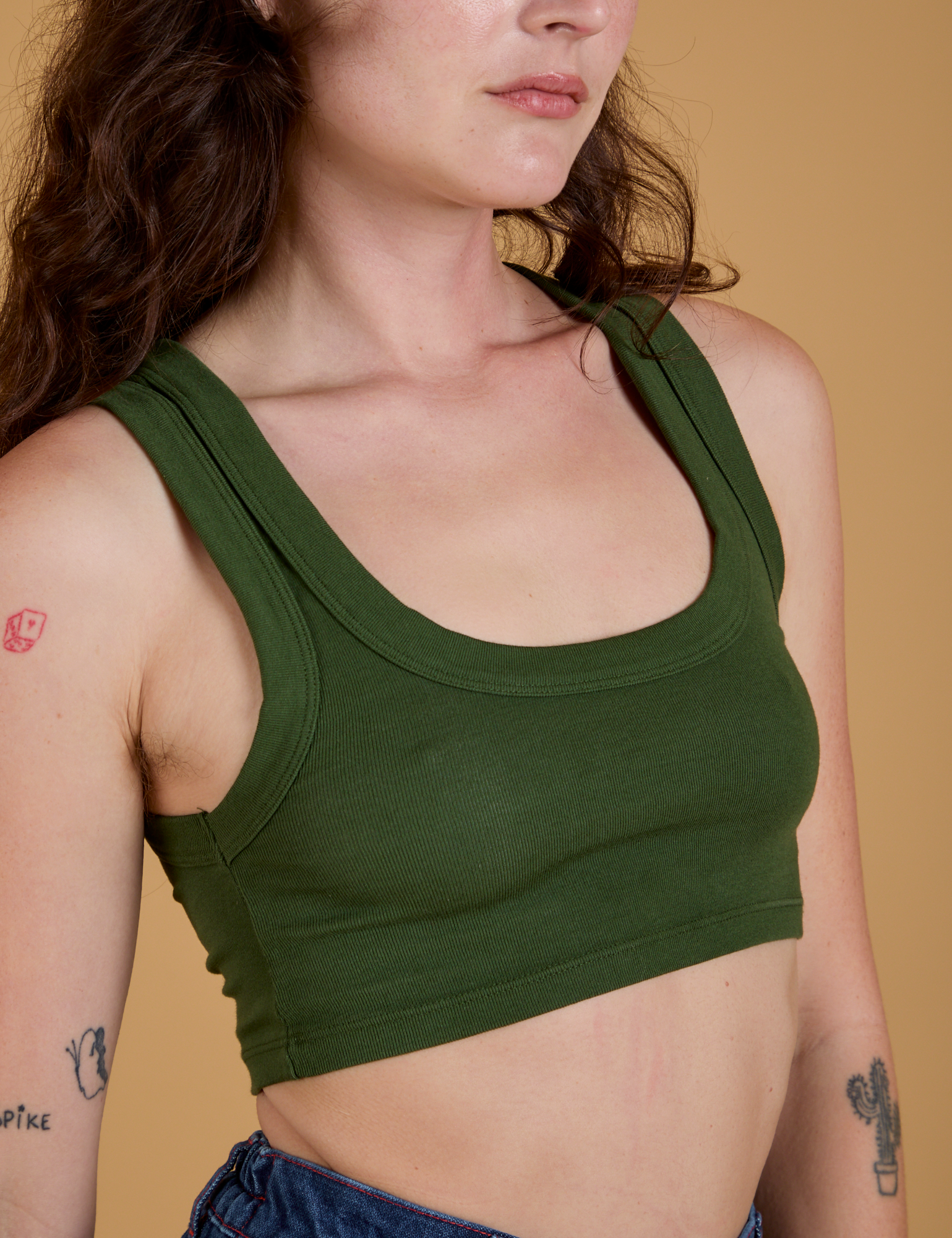 Front close up of Mini Tank in Evergreen worn by Alex