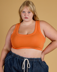 Juliet is 5’7” and wearing L Contrast Stitch Mini Tank in Construction Orange