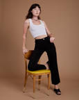 Alex is wearing Organic Work Pants in Basic Black and vintage tee white Cropped Tank