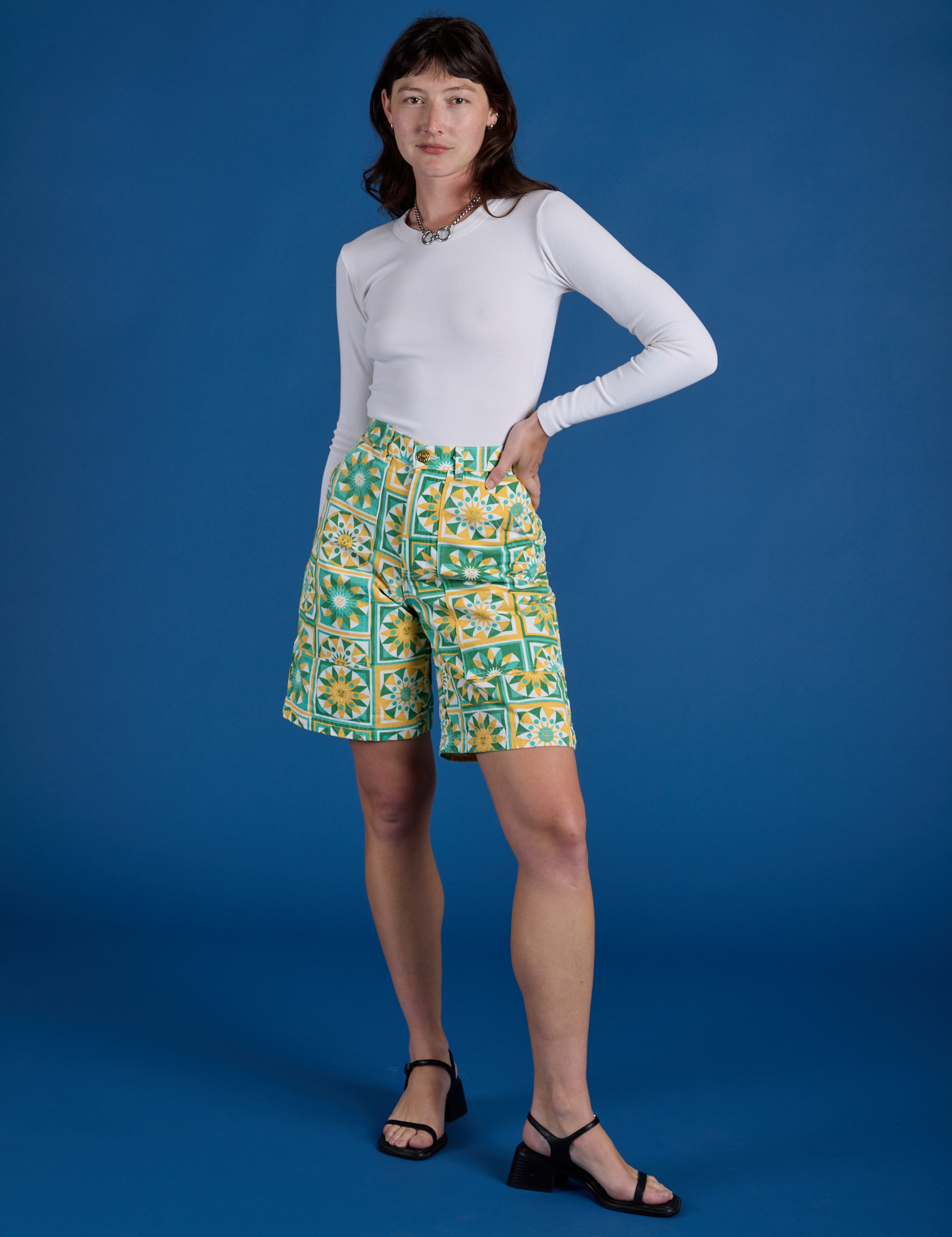 Alex is wearing Longline Work Shorts in Spring Quilt Print and vintage tee white Long Sleeve Baby Tee