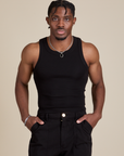 Isaac is 5’10” and wearing S Racerback Tank in Black
