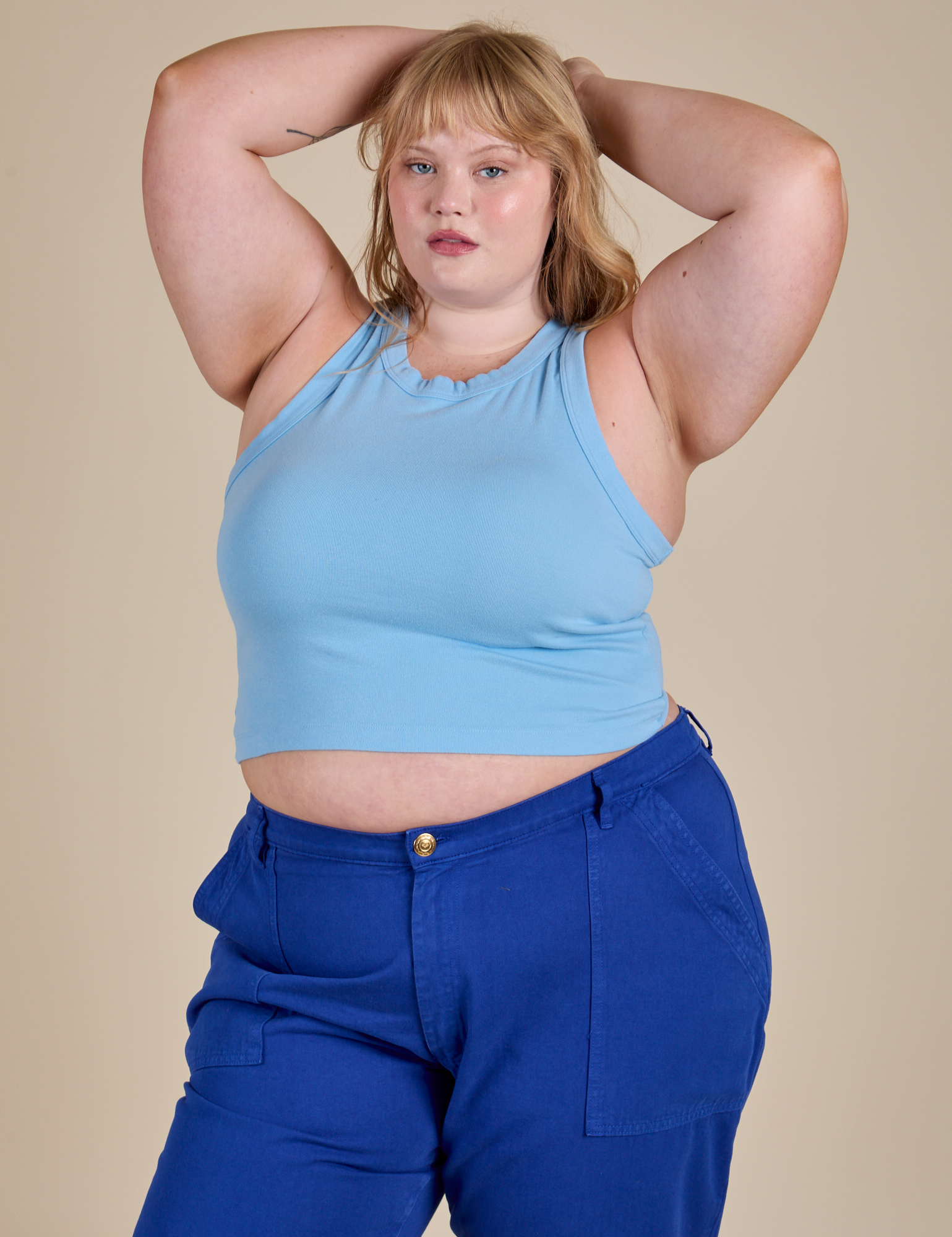 Juliet is 5’7” and wearing L Racerback Tank in Baby Blue