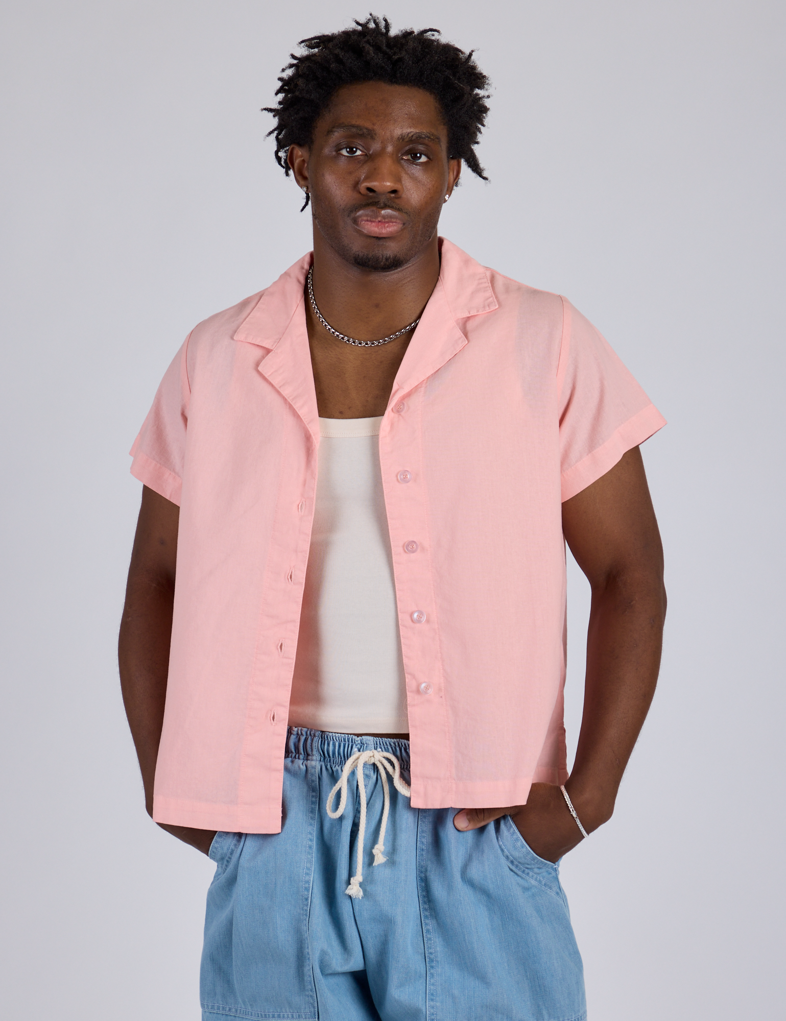 Isaac is 5’10” and wearing M Pantry Button-Up in Baby Pink