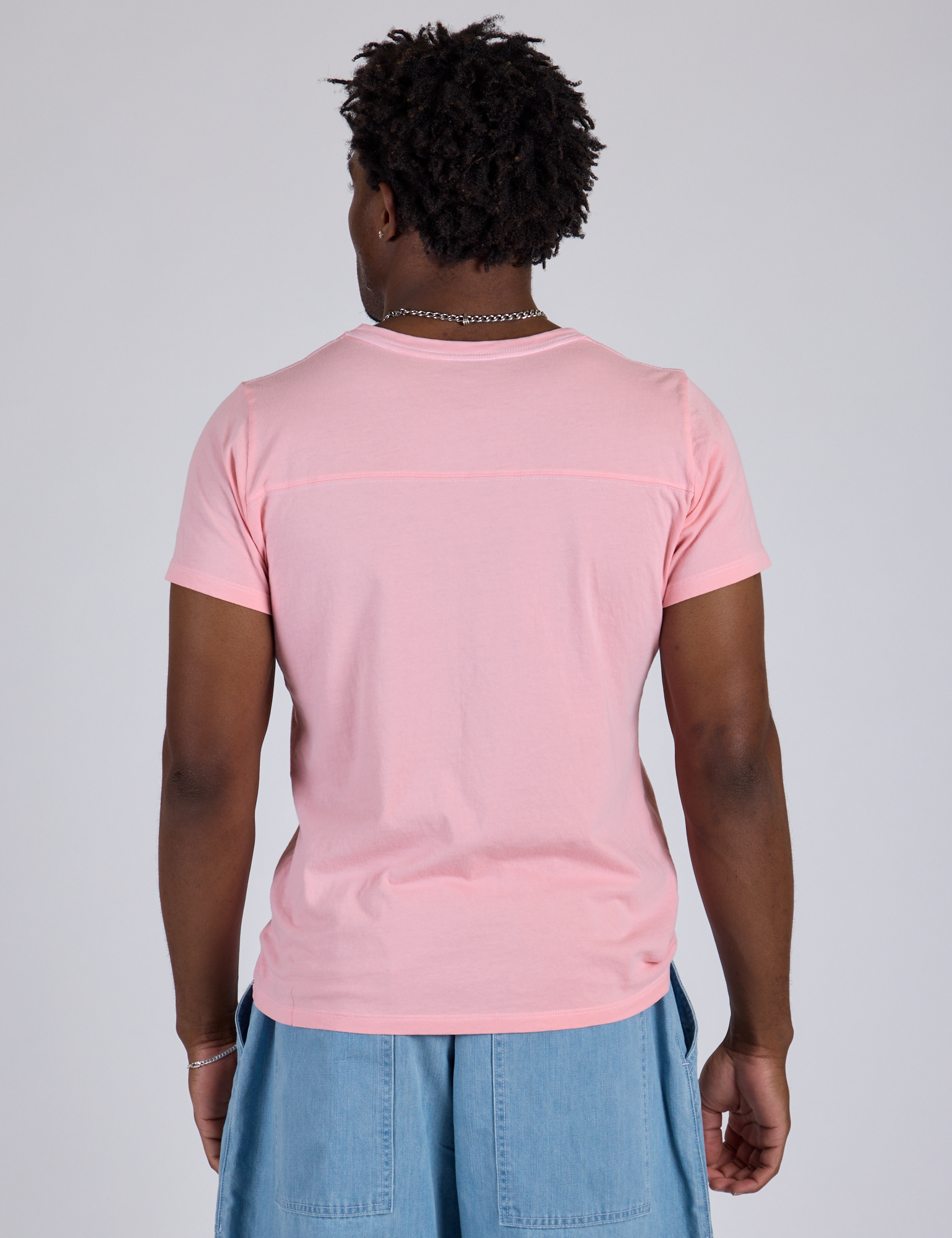 Jr. Varsity Tee in Baby Pink back view on Isaac