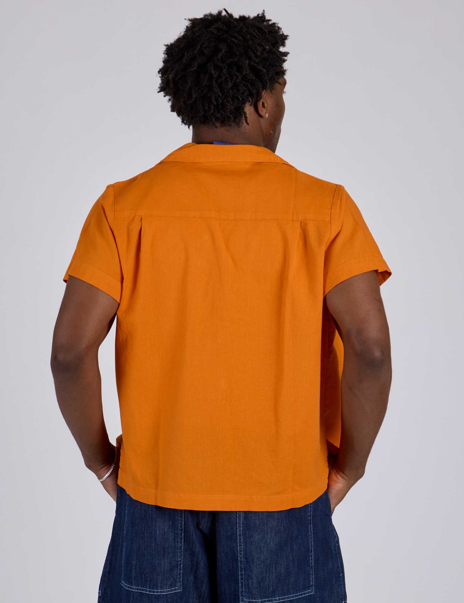 Pantry Button-Up in Creamsicle Orange back view on Isaac