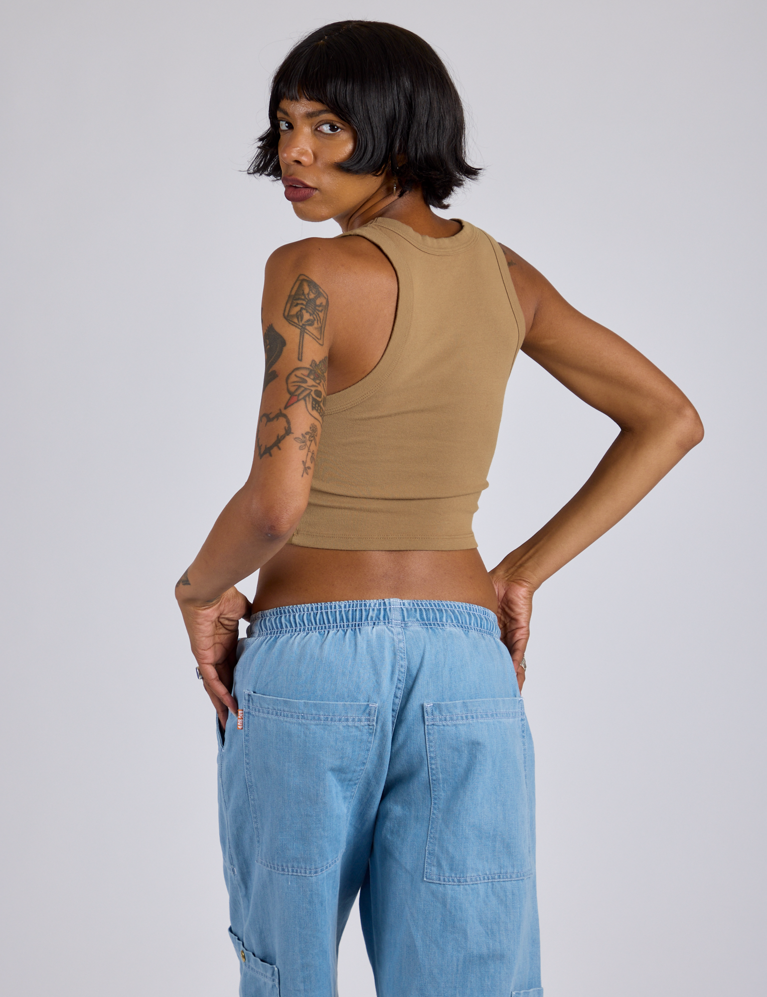 Cropped Tank Top in Desert Brown angled back view on Kira