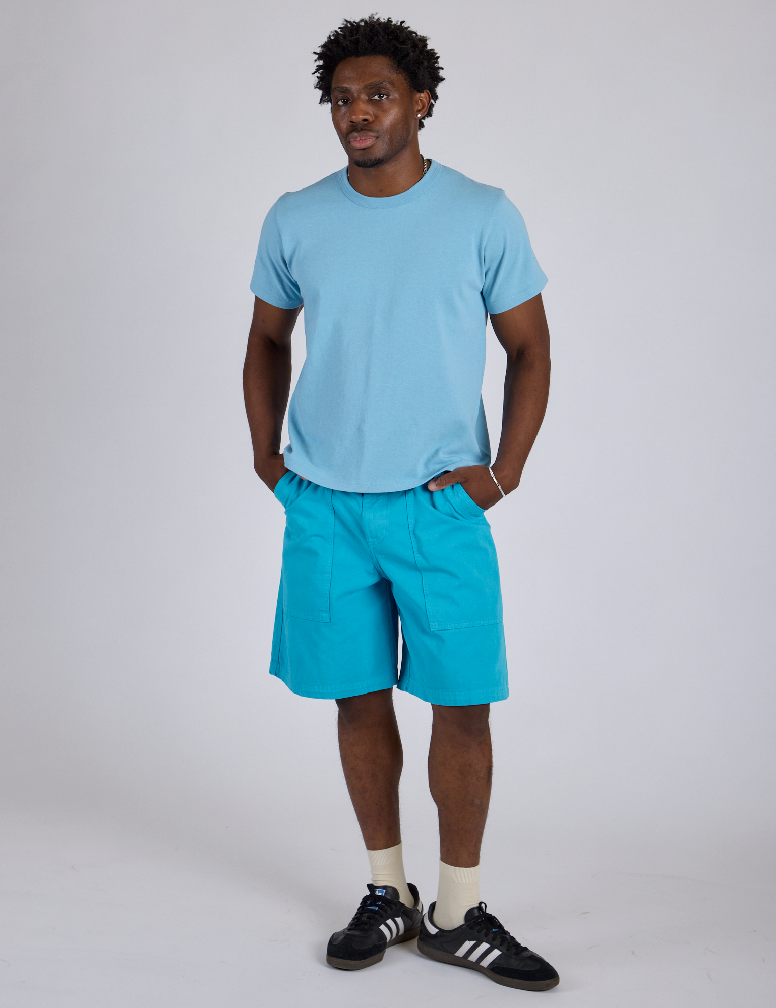 Isaac is 5’10” and wearing M Longline Work Shorts in Hawaiian Blue paired with baby blue Organic Vintage Tee