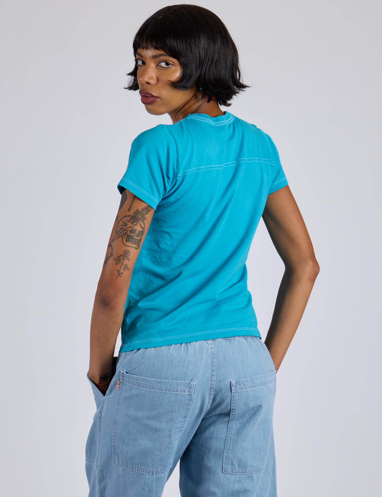 Jr. Varsity Tee in Hawaiian Blue back view on Kira