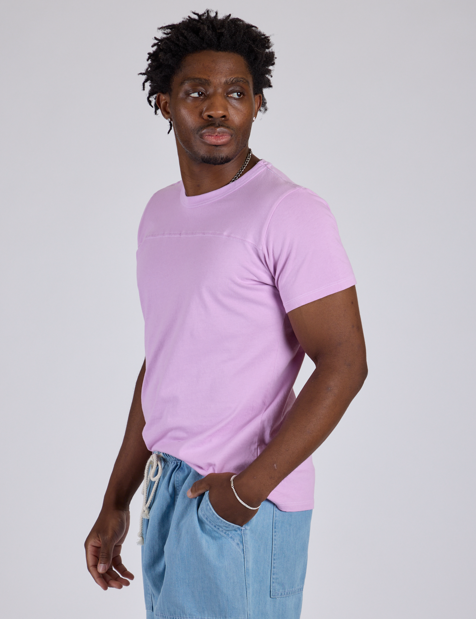 Jr. Varsity Tee in Lilac Purple side view on Isaac