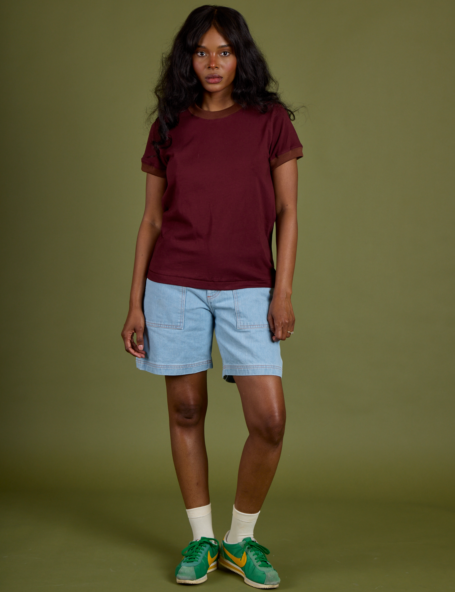 Kandia is wearing Vintage Ringer Tee in Red Wine paired with light wash Carpenter Shorts 