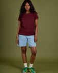 Kandia is wearing Vintage Ringer Tee in Red Wine paired with light wash Carpenter Shorts 