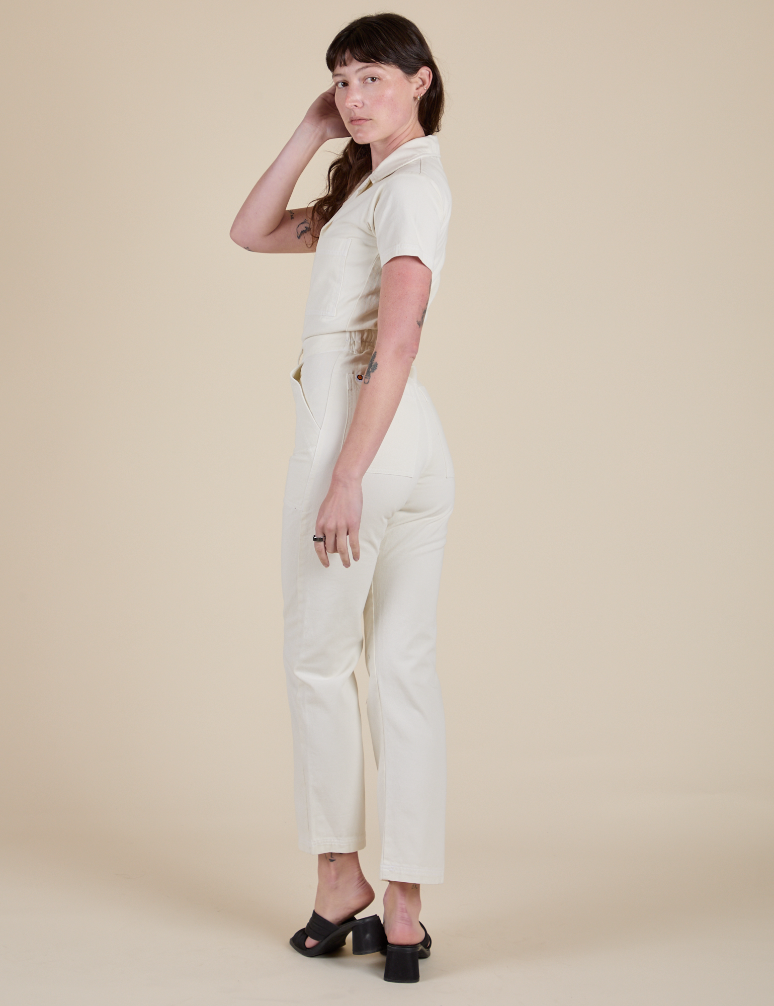Angled back view of Short Sleeve Jumpsuit in Vintage Tee White on Alex