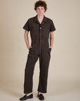 Quinn is 6'3" and wearing L Short Sleeve Jumpsuit in Espresso Brown