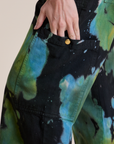 Close up of Alex's hand in the Magic Waters Drop Pocket Pants in Green Pool pant leg pocket 