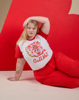 Juliet is wearing Vintage Tee in Call Me and mustang red WorK Pants