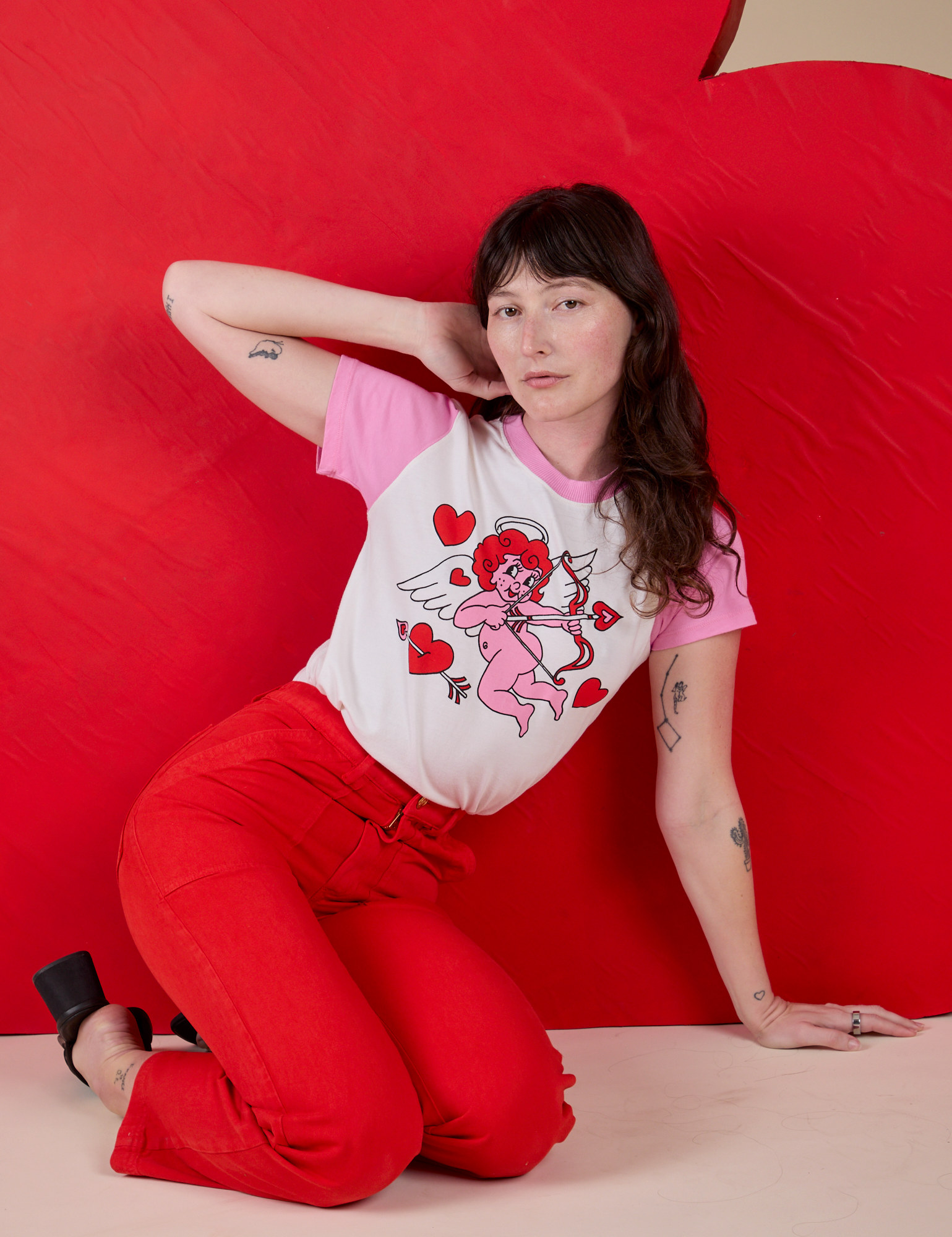 Vintage Tee in Cupid and mustang red Work Pants worn by Alex
