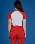 Back view of Produce Raglan Tee in Tomato on Alex