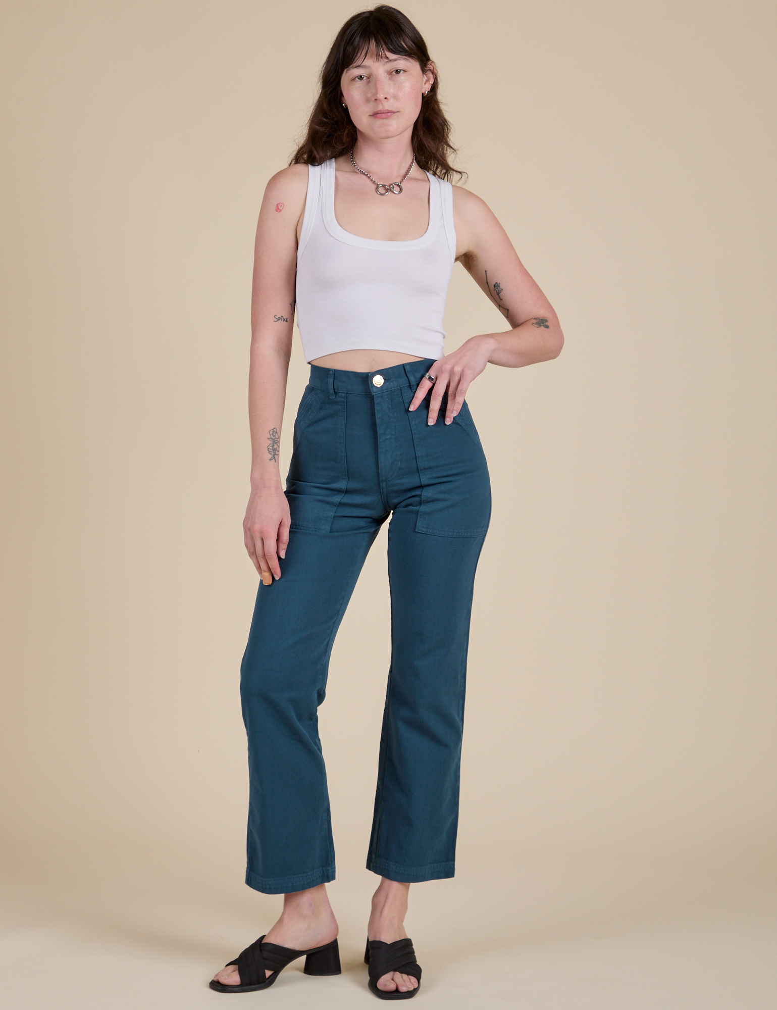 Alex is 5’8” and wearing XS Work Pants in Lagoon