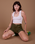 Alex is wearing Classic Work Shorts in Surplus Green and vintage off white Cropped Tank