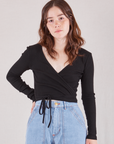 Hana is 5'3" and wearing size 1  Wrap Top in Basic Black