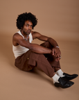 Jerrod is wearing Drop Pocket Cargo Pants in Fudgesicle Brown