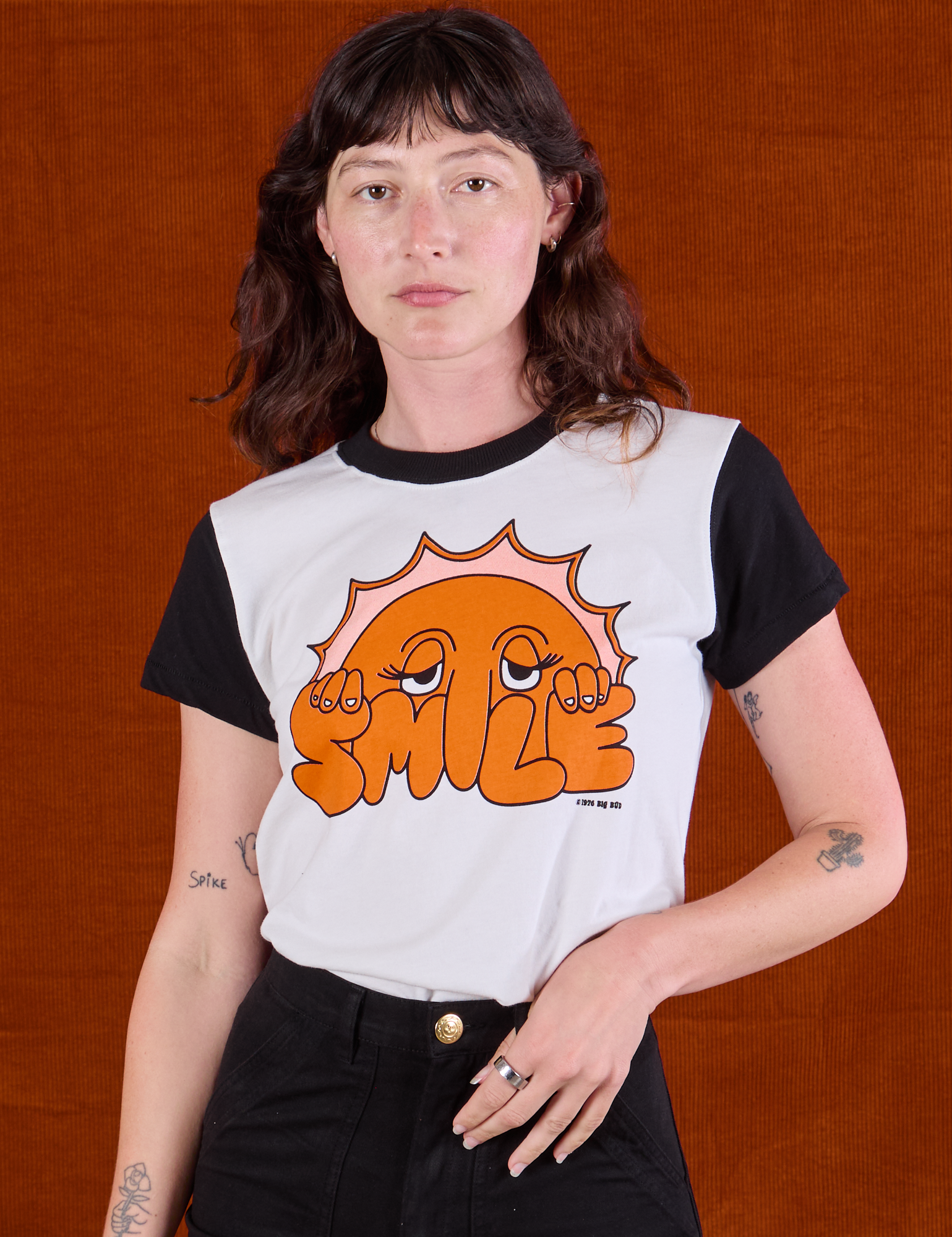 Anniversary Tee in Smile worn by Alex