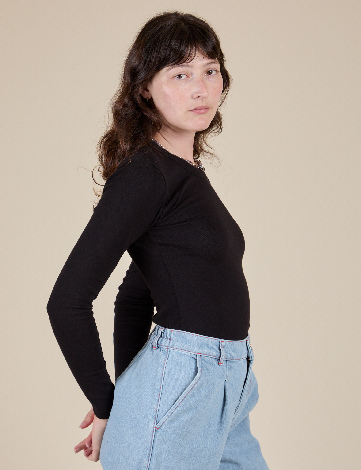 Long Sleeve Baby Tee in Basic Black side view on Alex