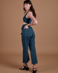 Action Pants in Lagoon angled back view on Alex