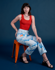 Work Pants in Sunny Cloud Airbrush and mustang red Tank Top on Alex