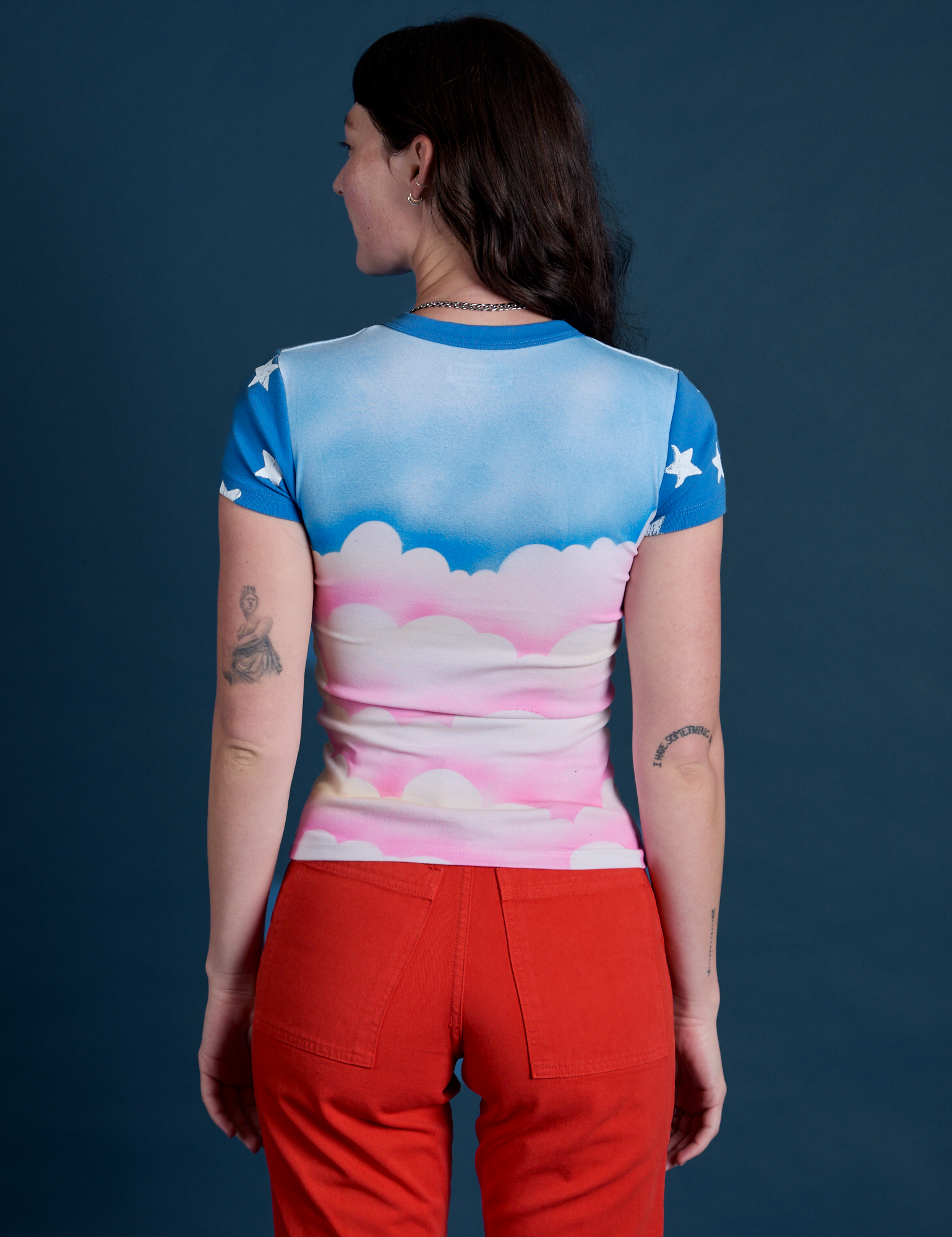 Airbrush Cloud Baby Tee back view on Alex