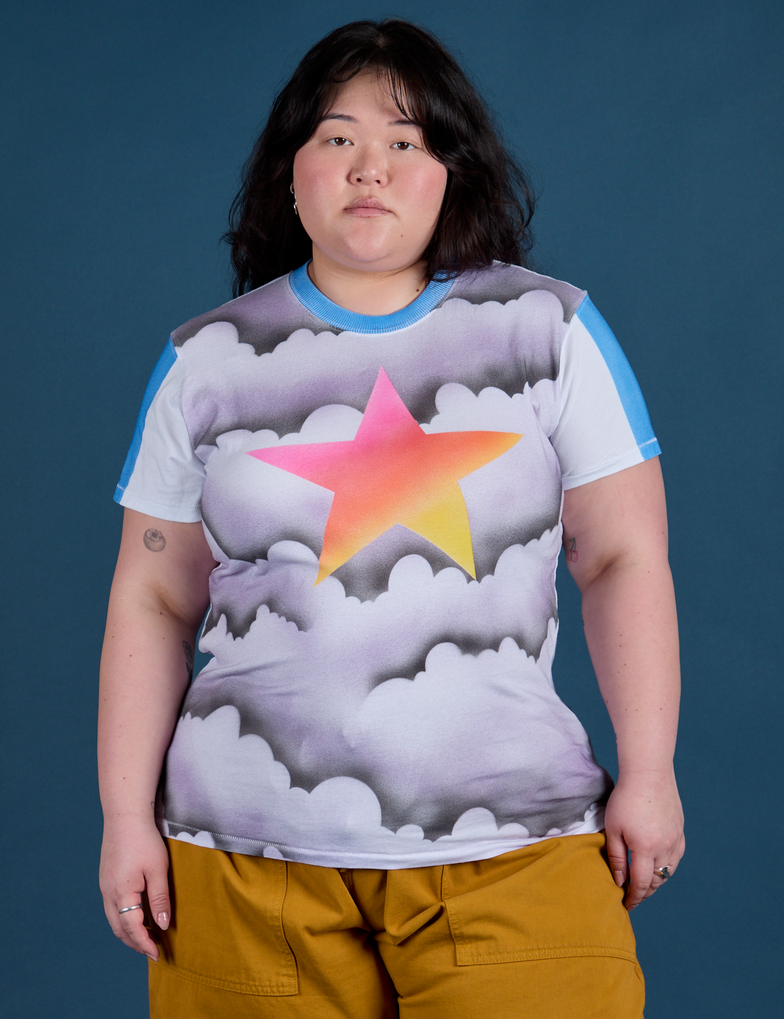 Ashley is 5’7” and wearing L Airbrush Star Vintage Tee