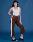 Angled front view of Painted Action Pants in Fudgesicle Brown and Cropped Tank in Vintage Tee White on Alex