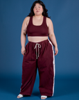 Ashley is 5’7” and wearing 1XL Painted Drop Pocket Cargo Pants in Red Wine paired with matching Mini Tank