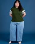 Ashley is 5’7” and wearing L Painted Vintage Tee in Evergreen paired with light wash Wide Leg Trousers