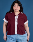 Ashley is 5’7” and wearing L Painted Pantry Button-Up in Red Wine