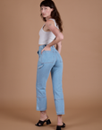 Carpenter Jeans in Light Wash angled back view on Alex