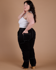 Angled back view of Carpenter Jeans in Black on Ashley