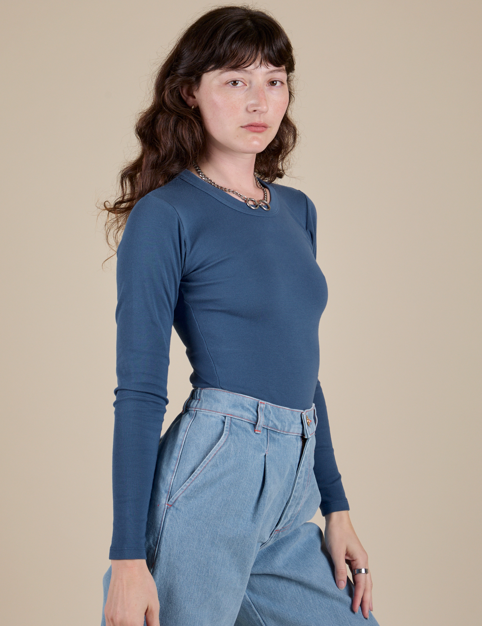 Side view of Long Sleeve Baby Tee in French Blue on Alex