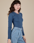 Side view of Long Sleeve Baby Tee in French Blue on Alex