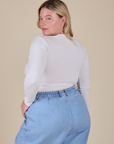 Long Sleeve Baby Tee in Vintage Tee Off-White angled back view on Lish